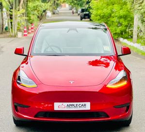 Tesla Model Y First Red With White 2024